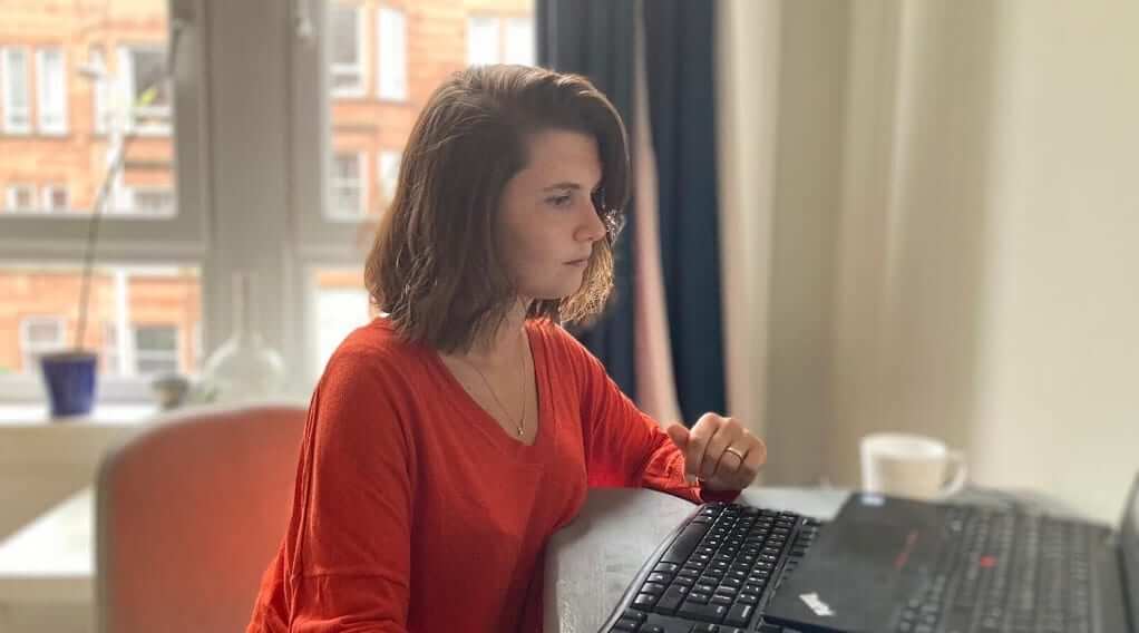 Image shows Fios Genomics Business Development Manager, Tanya, working at a desk
