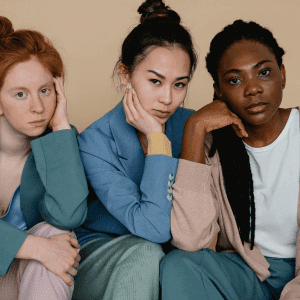 A photograph of 3 women who look unhappy