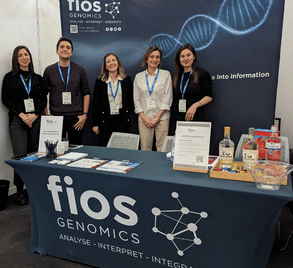 Member of the Fios genomics team pictures need to the Fios Genomics exhibition booth at the festival of Genomics and Biodata 2023